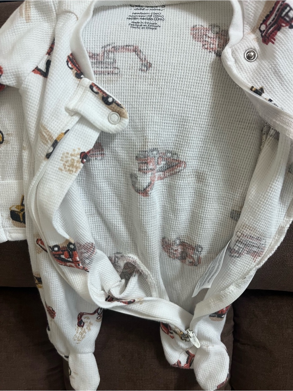 White Baby waffle Footed Sleeper with Red & Brown Truck Print